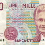 Moneta da 5 Lire con delfino, simbolo di valore collezionistico.